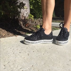 Glitter sneakers black and silver on the bottom.